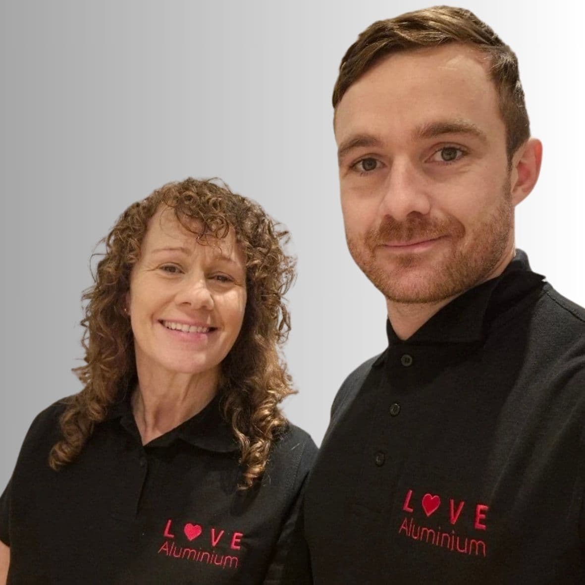 The founders wearing the branded tees