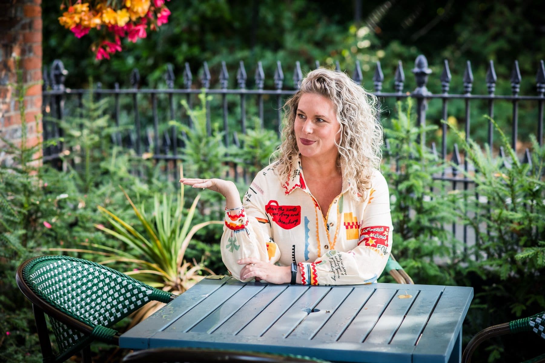 Tanya talking through marketing ideas at an outdoor table
